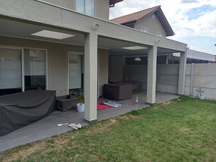 CONSTRUCCION DE ESTACIONAMIENTO CON RADIER DE HORMIGON Y PORCELANATO, COBERTIZO AMERICANO Y LOGIA, CONDOMINIO LAS TRANQUERAS, CASA 29, CHICAUMA